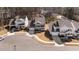 Aerial view of modern homes in a neighborhood featuring well-maintained landscaping and cul-de-sac at 2609 Aster Ct, Apex, NC 27502