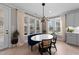 Bright and elegant dining nook, featuring contemporary lighting, designer furnishings and natural light at 2609 Aster Ct, Apex, NC 27502