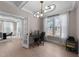 Bright home office featuring a large window, contemporary lighting, and comfortable workspace at 2609 Aster Ct, Apex, NC 27502