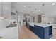Modern kitchen featuring a large island with a farmhouse sink, stainless steel appliances, and ample counter space at 2609 Aster Ct, Apex, NC 27502