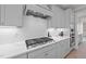 Well-equipped kitchen featuring granite countertops, custom cabinetry, and stainless steel appliances at 2609 Aster Ct, Apex, NC 27502