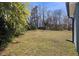 Wide backyard, with view of house and gutter downspout at 2611 Atlantic St, Durham, NC 27707