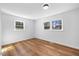 Bright bedroom featuring hardwood floors and natural light from the double windows at 2611 Atlantic St, Durham, NC 27707