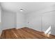Neutral bedroom featuring hardwood floors and a double door closet at 2611 Atlantic St, Durham, NC 27707