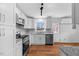 Newly remodeled kitchen with stainless steel appliances and sleek granite countertops at 2611 Atlantic St, Durham, NC 27707