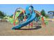 Colorful dragon themed playground equipment with slides and climbing structures at 264 Beacon Dr, Pittsboro, NC 27312