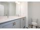 Elegant bathroom with dual sinks, quartz countertop, stylish starburst tile flooring, and modern fixtures at 283 Beacon Dr, Pittsboro, NC 27312