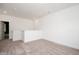 Bright, carpeted hallway area with white walls, base trim, and door into a bedroom at 283 Beacon Dr, Pittsboro, NC 27312