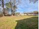 Spacious backyard with mature trees and a playset at 2918 Avalon Rd, Rocky Mount, NC 27801