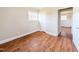 Cozy bedroom featuring hardwood floors and ample natural light from the bright window at 2918 Avalon Rd, Rocky Mount, NC 27801
