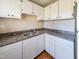 Bright kitchen features white cabinetry, dual basin sink, and plenty of counter space at 2918 Avalon Rd, Rocky Mount, NC 27801