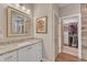 Bathroom featuring granite countertops, walk-in closet and hardwood floors at 295 Cedar Rock Trl, Fuquay Varina, NC 27526