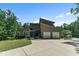 Stunning contemporary home featuring a two-car garage, stone accents, and professional landscaping at 295 Cedar Rock Trl, Fuquay Varina, NC 27526
