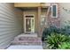 Front entrance showcasing stone steps, pillars, and a modern door with glass detail at 295 Cedar Rock Trl, Fuquay Varina, NC 27526