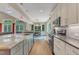 Gourmet kitchen with a center island, modern appliances, and an open layout to the dining area at 295 Cedar Rock Trl, Fuquay Varina, NC 27526