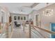 Bright loft with a vaulted ceiling, comfortable seating, and an eye-catching light fixture at 295 Cedar Rock Trl, Fuquay Varina, NC 27526