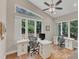 Inviting home office with vaulted ceilings, large windows, and modern desks, creating a productive and inspiring workspace at 295 Cedar Rock Trl, Fuquay Varina, NC 27526