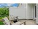 Relaxing backyard featuring a patio with comfortable seating, a fence, and lush greenery at 296 Perseus St, Angier, NC 27501