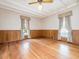 Spacious bedroom with hardwood floors, classic trim, and large windows at 298 E Salisbury St, Pittsboro, NC 27312