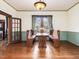 Charming dining room with hardwood floors and a window bench to create a cozy and inviting atmosphere at 298 E Salisbury St, Pittsboro, NC 27312