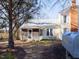 Quaint home featuring a metal roof and a screened-in porch, nestled in a serene landscape at 298 E Salisbury St, Pittsboro, NC 27312