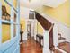 Grand foyer with hardwood floors, staircase, and stylish decor at 298 E Salisbury St, Pittsboro, NC 27312