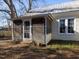 Charming front porch with lattice, creating a cozy and inviting entrance to the home at 298 E Salisbury St, Pittsboro, NC 27312