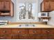 Close up of a kitchen sink featuring double basin, wood counters and cabinets at 298 E Salisbury St, Pittsboro, NC 27312
