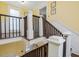 Bright staircase features wood railings and white accents, connecting multiple levels of the home at 298 E Salisbury St, Pittsboro, NC 27312