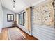 Bright sunroom with wood-look floors and a vintage rug to create a warm and welcoming space at 298 E Salisbury St, Pittsboro, NC 27312