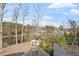 Scenic backyard view showcasing lake, landscaping, and a charming gazebo for outdoor enjoyment at 302 Edinburgh Dr, Cary, NC 27511