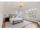 Bright and airy bedroom with large windows, a comfortable bed, and stylish decor at 302 Edinburgh Dr, Cary, NC 27511