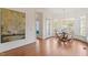 Charming breakfast nook with hardwood floors and a large bay window with a dining table at 302 Edinburgh Dr, Cary, NC 27511