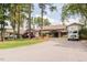 Beautiful clubhouse featuring manicured lawns, mature trees, and ample parking at 302 Edinburgh Dr, Cary, NC 27511