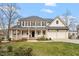 Charming two-story home featuring a welcoming front porch and a two-car garage at 302 Edinburgh Dr, Cary, NC 27511