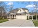 Charming two-story home featuring a welcoming front porch and a two-car garage at 302 Edinburgh Dr, Cary, NC 27511