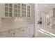 Elegant hallway featuring custom cabinetry and marble floors with views to the home's interior at 302 Edinburgh Dr, Cary, NC 27511