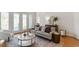Elegant living room featuring a comfortable sofa, stylish decor, and plenty of natural light at 302 Edinburgh Dr, Cary, NC 27511