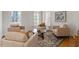 Bright living room featuring neutral-toned furniture, a stylish rug, and lots of natural light at 302 Edinburgh Dr, Cary, NC 27511