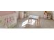 A playroom with a small table and chairs, a toy house, and a play tent at 302 Edinburgh Dr, Cary, NC 27511