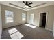 Neutral colored bedroom featuring trey ceilings, a ceiling fan, and carpeted floors at 314 S Darden St, Kenly, NC 27542