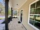 Inviting front porch view with dark columns, a 'Welcome' mat, and lots of natural light at 314 S Darden St, Kenly, NC 27542