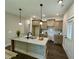 Modern kitchen features stainless steel appliances, grey cabinets, and modern lighting at 315 S Maple Ave, Kenly, NC 27542