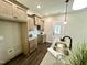 Modern kitchen featuring stainless steel appliances, granite counters and breakfast bar at 315 S Maple Ave, Kenly, NC 27542