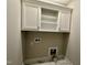 Laundry area with cabinetry, washer/dryer hookups, and tiled floors at 315 S Maple Ave, Kenly, NC 27542
