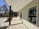 Inviting covered front porch with sturdy support columns, a view of the yard, and access to the front door at 315 S Maple Ave, Kenly, NC 27542