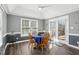 Cozy dining room with vaulted ceilings, French doors to deck, and modern lighting at 3213 Leebrook Rd, Raleigh, NC 27616