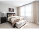 Comfortable bedroom featuring a king bed, neutral tones, and soft textures for a relaxing atmosphere at 353 Murray Grey Ln, Wake Forest, NC 27587