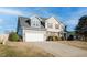 Spacious two-story home with a two-car garage and inviting curb appeal at 3800 Long Meadow Dr, Mebane, NC 27302