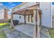 A covered patio is accessible from the backyard of this house at 4217 Old Brick Ct, Raleigh, NC 27616